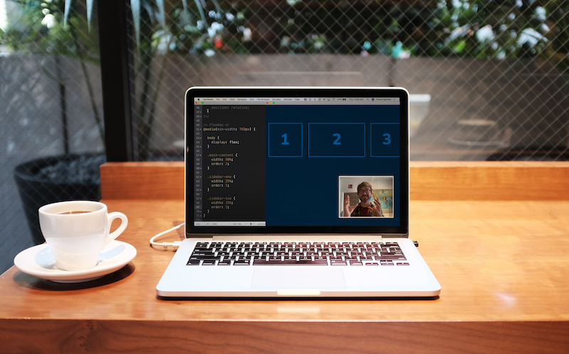 Terminal and videoconference open on a laptop