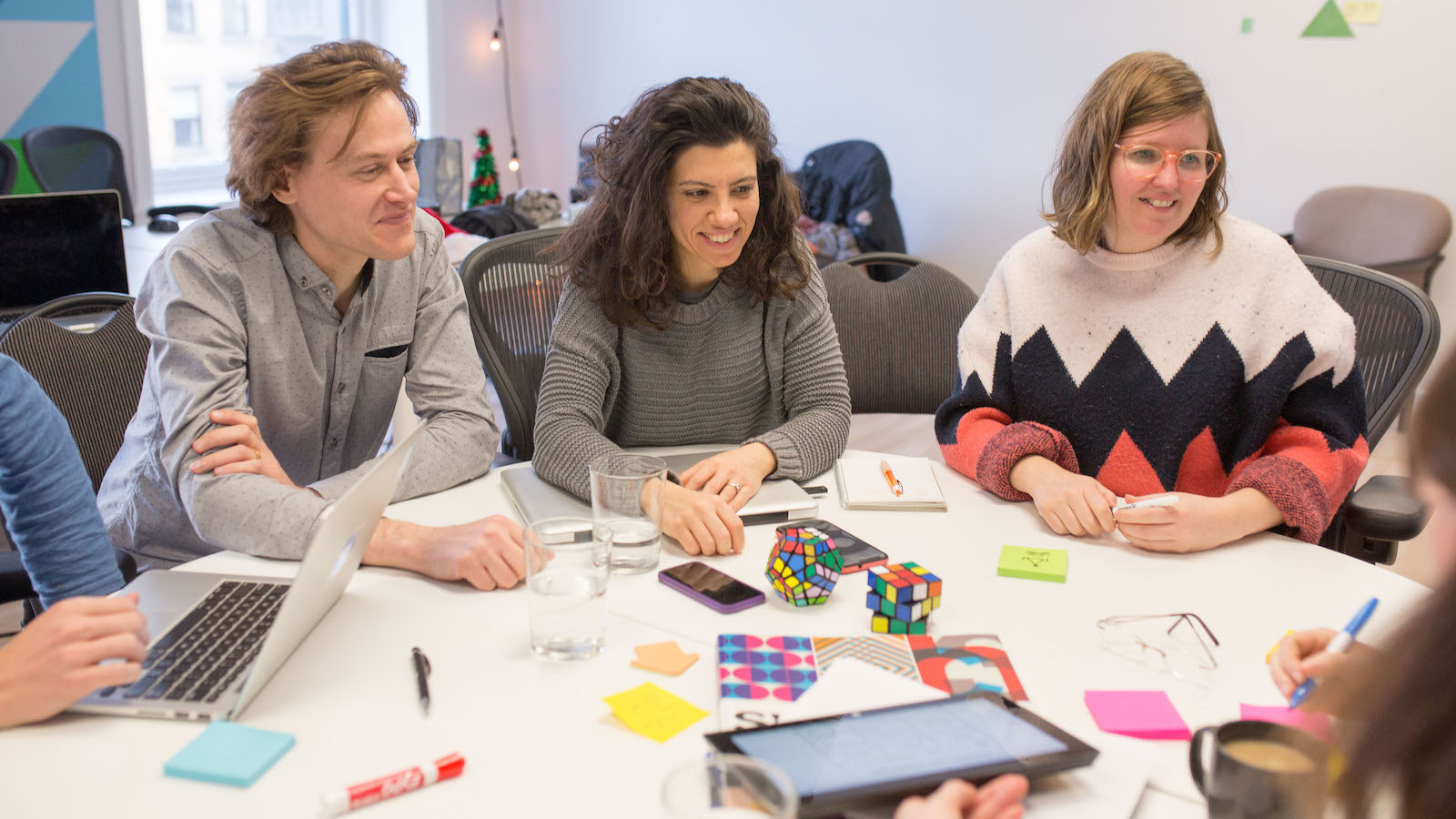 People learning around a table