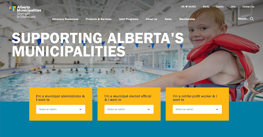 Screenshot of the Alberta Municipalities website homepage. A banner image of a smiling child in a swimming pool with a lifejacket appears in the background. Overlaid text reads “Supporting Alberta’s Municipalities.” Below, three yellow drop-down boxes prompt users to identify themselves as either a municipal administrator, a municipal elected official, or a not-for-profit worker, with the phrase “I want to…” followed by tailored options.