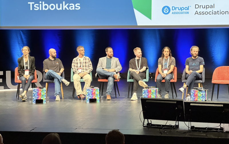 Seven Strategic Initiative Leads sit on stage at DrupalCon Lille