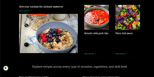 A dark-themed recipe website featuring a grid of food articles and recipes, with one oatmeal dish outlined in green to indicate keyboard focus.