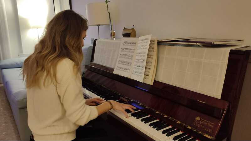 Elena playing the piano.