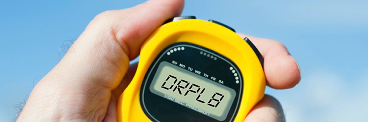 Hand holding stopwatch that says DRPL8