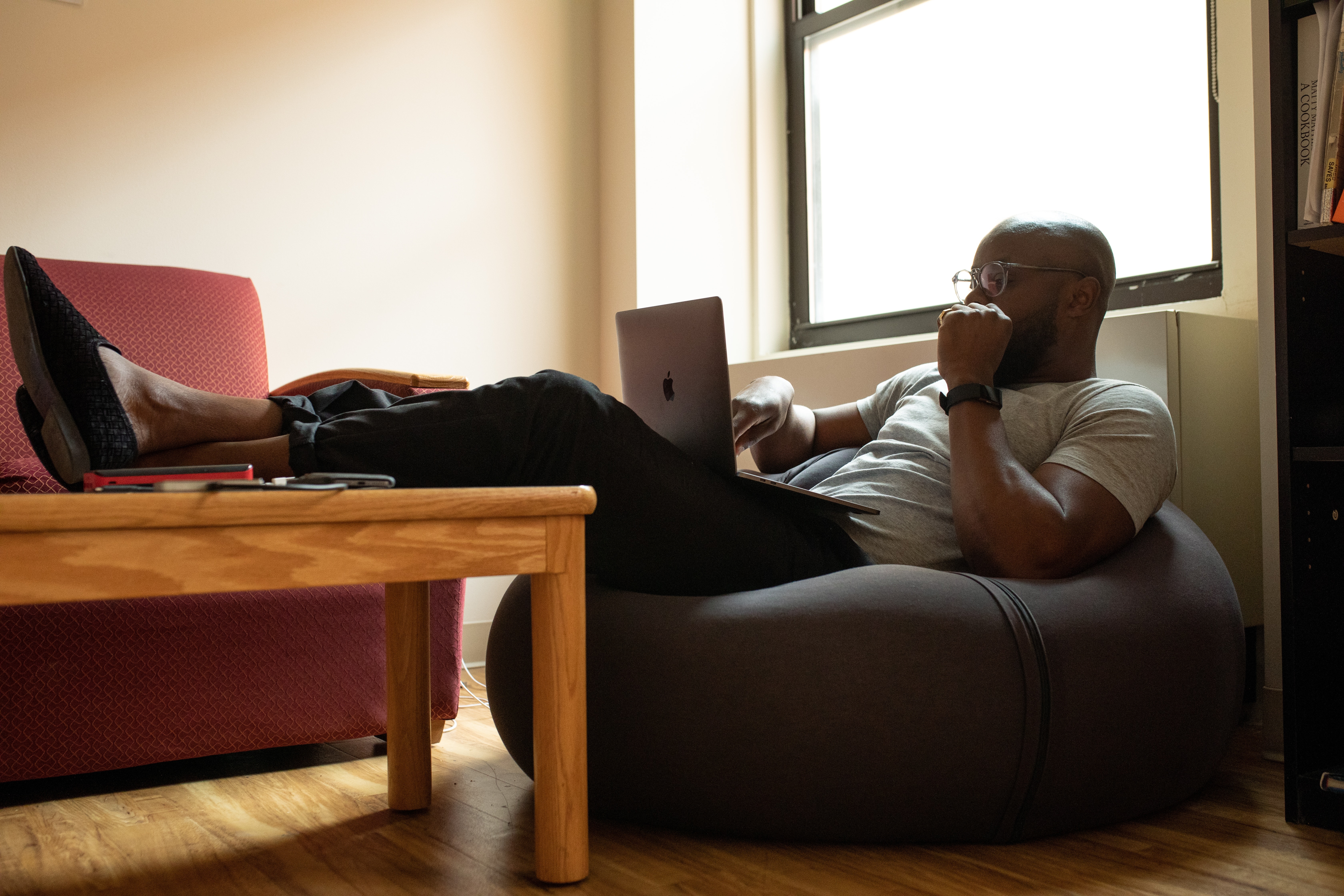 Young man comfortably working from home in a computer
