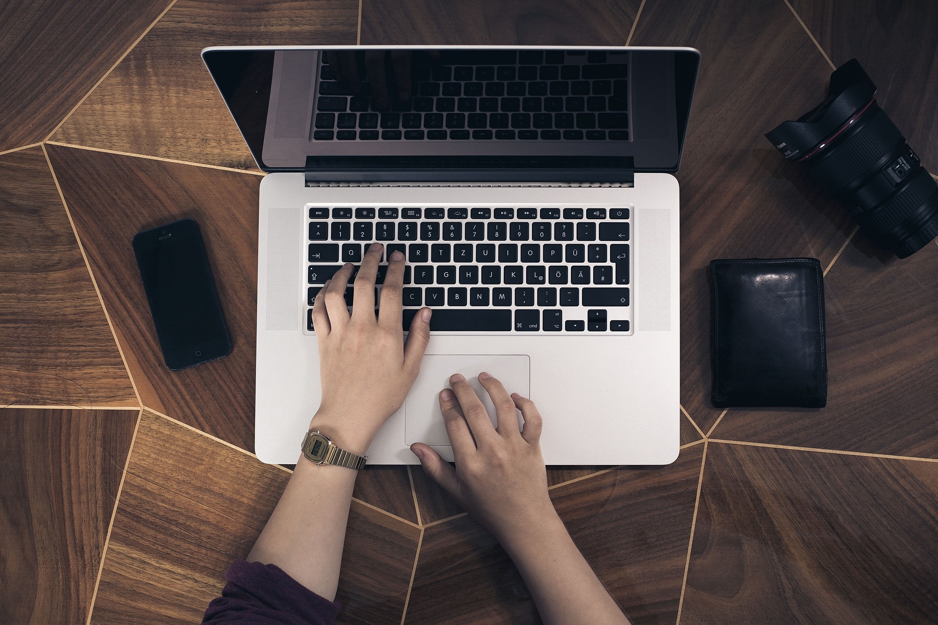 Pic of someone writing on a laptop