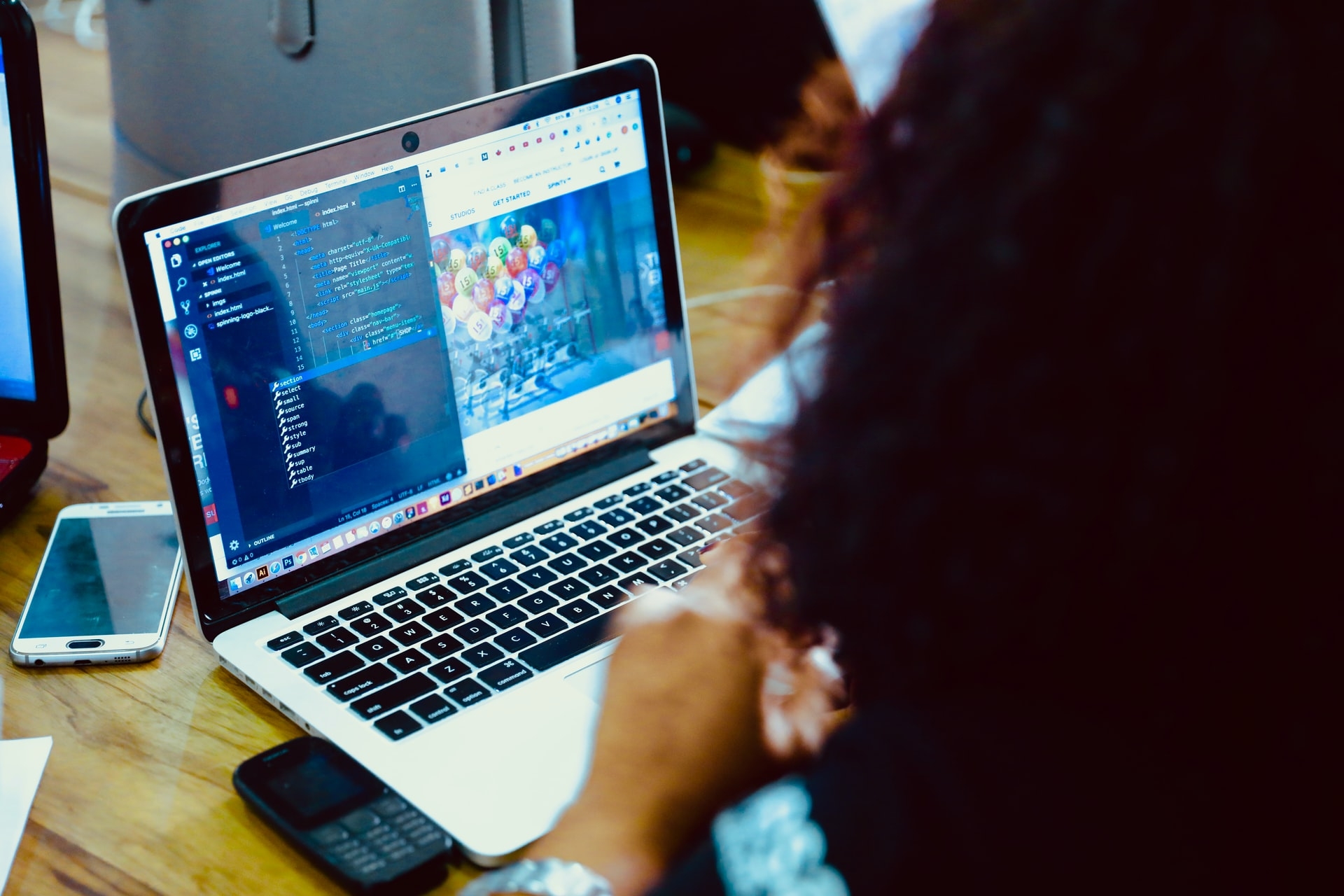 Woman coding on a laptop
