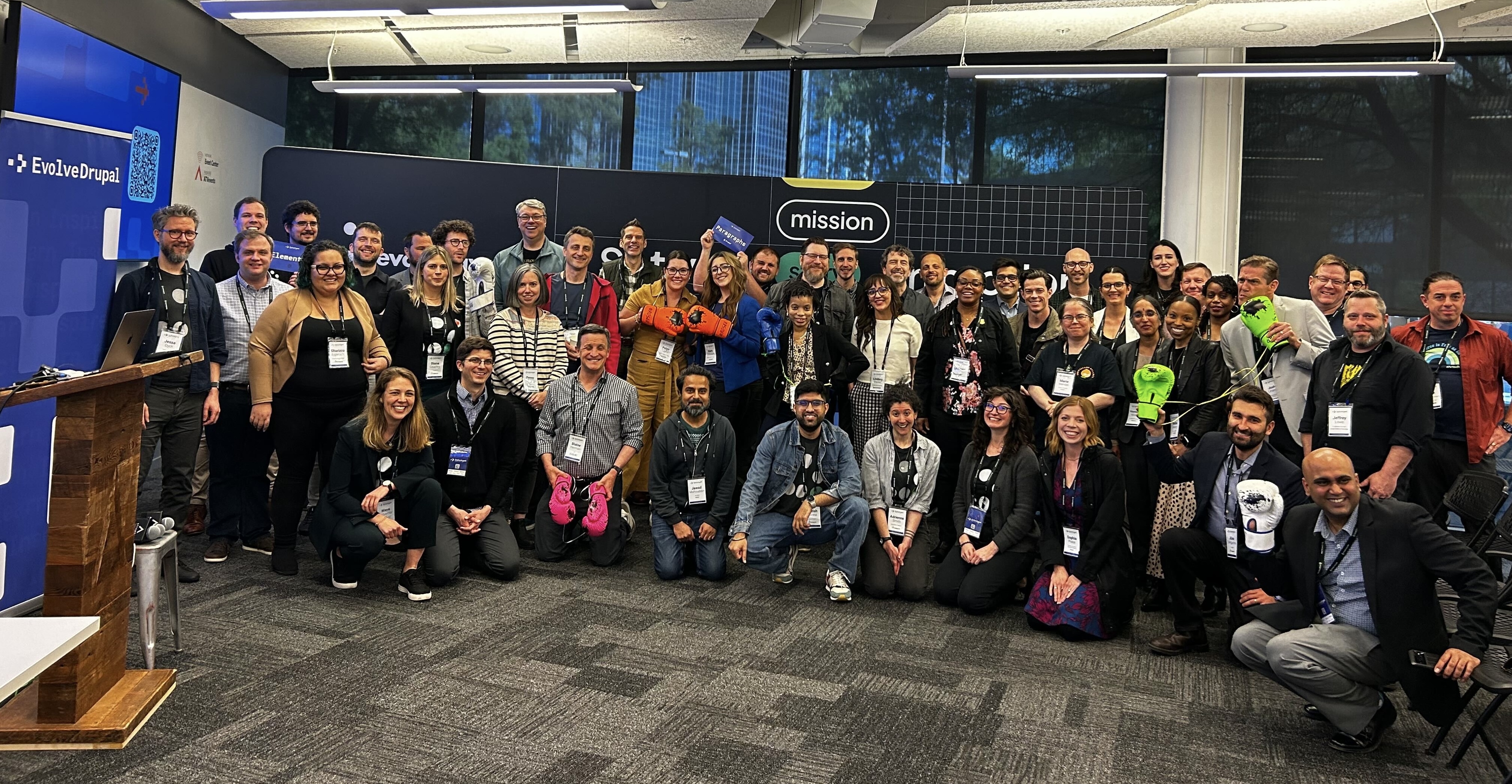 A large group of people gathered and posing for the photo