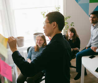 Learning together at a whiteboard