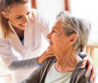 Elderly patient with a smiling doctor