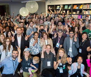Attendees posing for a group photo at EvolveDigital Summit NYC