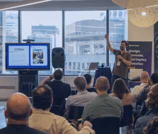 Josh Koenig presenting to a crowd in NYC
