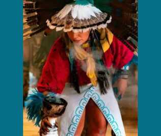 An Indigenous dancer in traditional dress