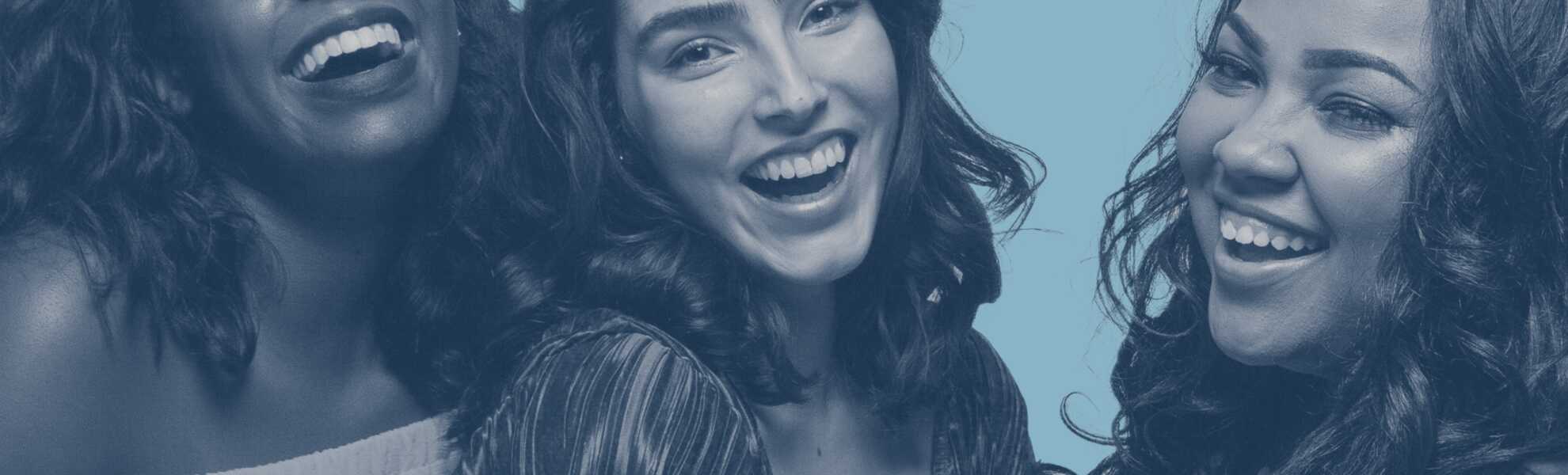 Three young women laughing