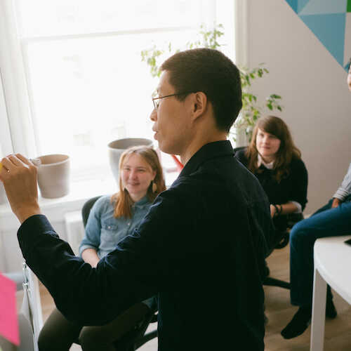 Learning together at a whiteboard