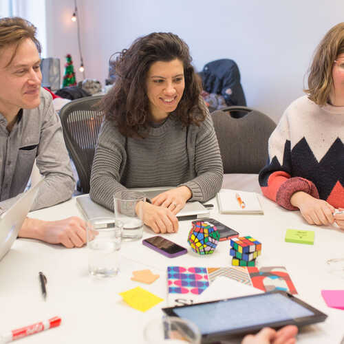 People learning around a table