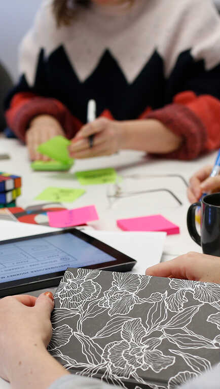 Co-workers collaborating around a table