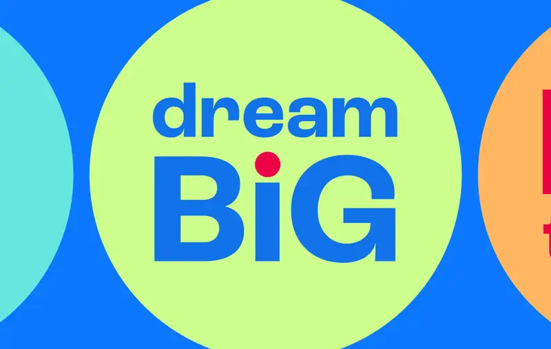 Un cercle vert avec le texte « dream Big » (rêver grand)