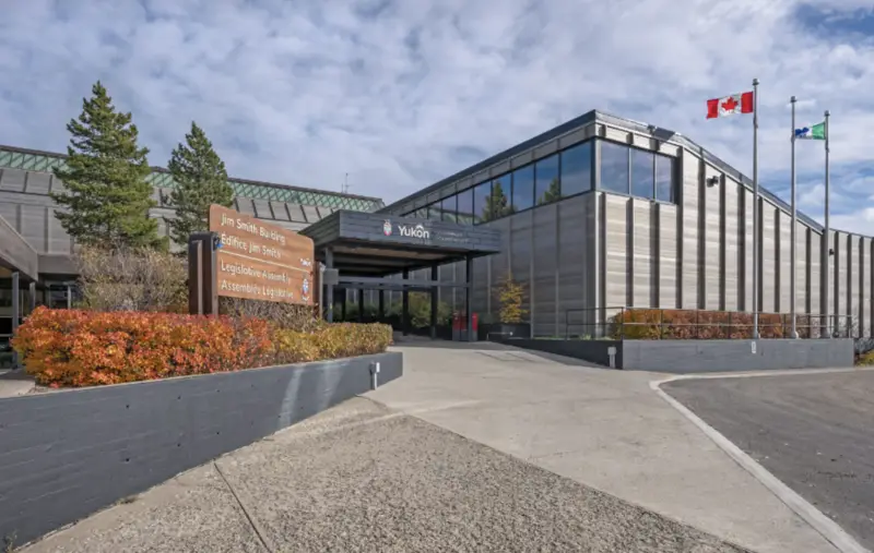 Government of Yukon building with some hints of nature and a beautiful sky